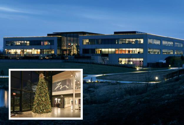 corporate office holiday décor graphic including an exterior image of the large office building with holiday lights and image of the lobby Christmas tree